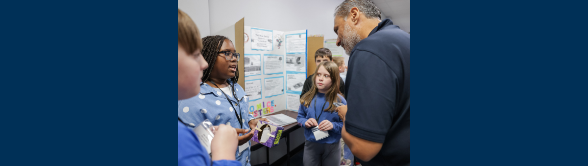 Students in Thomasville, Ga. explain their invention to a competition judge as a part of Georgia Tech’s expanding K-12 InVenture Prize program. 